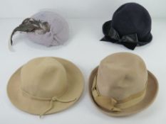 A vintage 100% wool felt hat by Viv Knowland in navy blue,