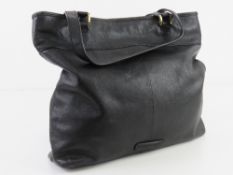 A black leather tote bag by Dickins & Jones approx 32cm wide.