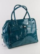 A turquoise patent overnight bag by Storm London approx 37cm wide.
