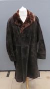 A suede coat by Hornes having acrylic fur lining, approx measurements 46