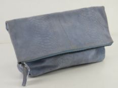 A blue suede fold over handbag having shoulder strap within by Top Shop approx 35cm wide.