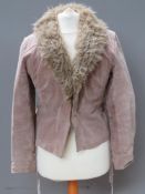 A suede type jacket having faux fur collar, labels partially removed,