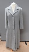 A 65% wool, 15% cashmere grey coat by Menuetto Berghaus, size 14, approx measurements; 42