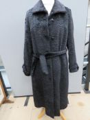 A vintage faux Black Persian wool coat by Jeune Elite, size 40, approx measurements; 47.