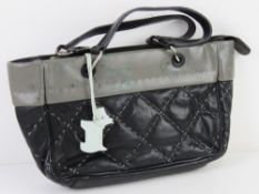A black and grey Radley handbag approx 23cm wide.