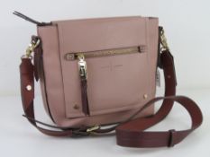 A blush pink and burgundy Jasper Conran handbag approx 29cm wide.