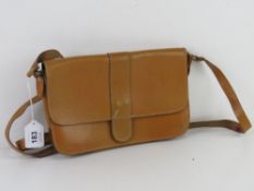 A mustard yellow vintage leather cross body bag, approx 26cm wide.