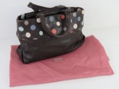 A brown polka dot Radley handbag complete with original dust bag, approx 30cm wide.