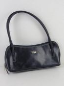 An Italian leather handbag in navy blue approx 33cm wide.