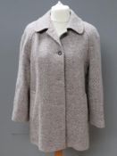 A pure new wool ladies coat by Laure of Leicester, approx measurements; 44