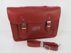 A burgundy satchel type handbag 'as new', approx 38 x 27cm.