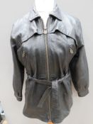 A ladies black leather jacket size 14 with belt, approx measurements; 40
