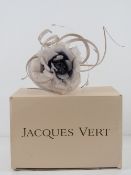 An 'as new' fascinator in blush and purple,