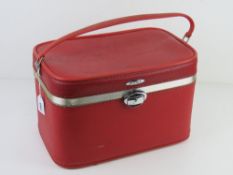A vintage red Antler travelling case having mirror to lid approx 36.5cm wide.