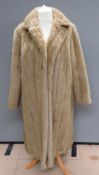 A vintage faux fur coat by Astraka, size 24, measurements approx 40