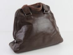 A brown leather handbag by Per Una, mark to lining noted, approx 35cm wide.