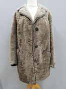 A vintage sheepskin jacket bearing label for Owen Barry, size 42,