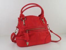 A red handbag approx 35cm wide having leopard print lining.