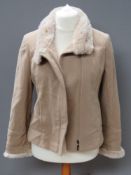 An 80% wool, 5% cashmere jacket having faux fur collar and cuff, approx measurements; 36