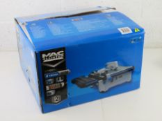 A MacAllister tile cutter, MTC650 180mm 650W. As new in box.