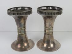 A pair of silver plated bud vases having Regency style fret work rim.