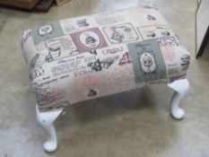 A Parker Knoll footstool re upholstered in chintz French pâtisserie fabric,