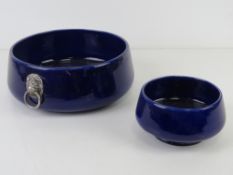 Two blue Wade Falstaff bowls, the larger having lion head handles and measuring 21cm diameter.