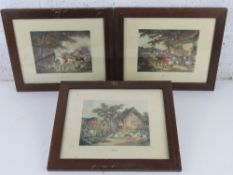 A set of three hunting themed prints 'engraved by E Bell' each framed and glazed and measuring