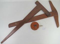 A vintage 66ft leather and brass cased tape measure marked Treble England No 1534 together with two