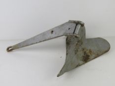 A sand anchor painted silver approx 40cm in length.