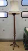 A carved mahogany Corinthian lamp standard, highly carved capital upon reeded column,