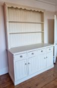 A large cream painted Welsh dresser.