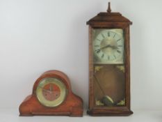 An early 20th century mantle clock having brass chapter ring.