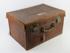 An antique silk lined leather travelling case, slightly a/f, with twin locks,