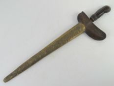 A Kris knife with scabbard.