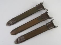 Three WWII M1 Garand bayonet scabbards.