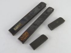 Four Beretta model 38 magazines together