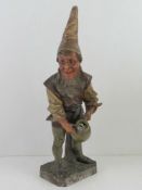 A continental plaster figurine of a gnome with water jug standing 51cm high.