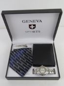 A Geneva Sports stainless steel wristwatch gift set in box with tie, tie clip and black leather