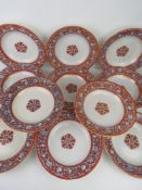 A set of c1850 Victorian dished by Davenport, having orange ground floral patterned border, each 17.