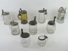 A quantity of assorted glass tankards inc BMF boars head design, hand painted ceramic and pewter lid