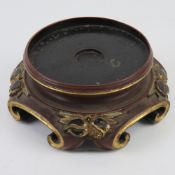 An Oriental lacquered hardwood stand, ebonised with red and gilt decoration upon, dia approx 10cm,