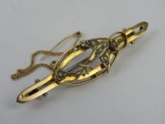 A 9ct gold Edwardian brooch having seed pearls and Swallow design, stamped 9c, 2.8g.