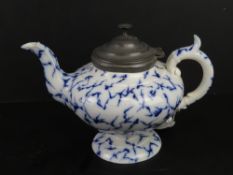 A blue and white mottled ceramic teapot having pewter lid marked 'Marble W' to base,