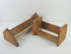 Two 20th century wooden book sleighs measuring 30cm and 46cm respectively.