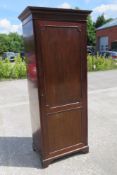 An Edwardian mahogany single door hall cupboard, door opening to reveal hanging compartment