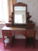 A substantial Edwardian dressing table, square shaped bevelled edge mirror over shaped supports with