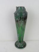 An early 20thC layered glass vase in the style of Gaille, handles deficient, standing 32cm high.