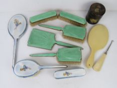 An Art Deco engine turned guilloche enamel dressing table set inc hand mirror,