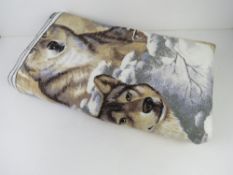 A wolf themed throw / blanket of American manufacture and measuring approx 225 x 182cm.